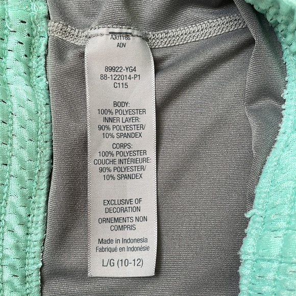 Champion. The inside the spandex is a light gray, the shorts are a light teal. - Picture 3 of 3